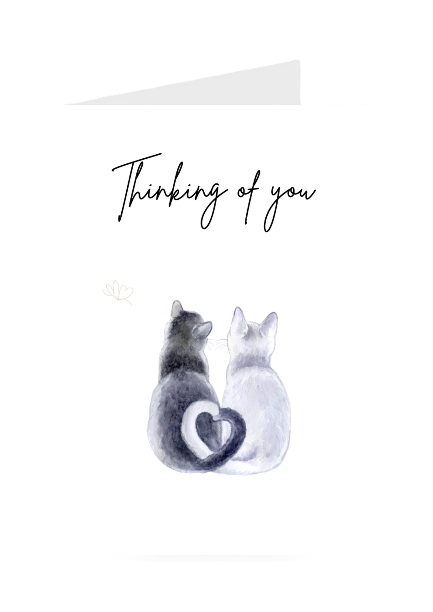 Two cats sitting back-to-back with a heart between them and 'Thinking of you' text greeting card on a white background.